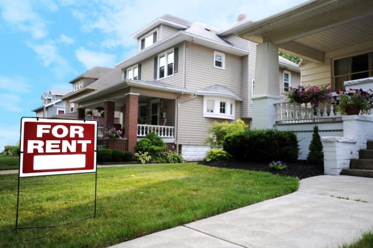 Home For Rent Sign in Front of Beautiful American Home